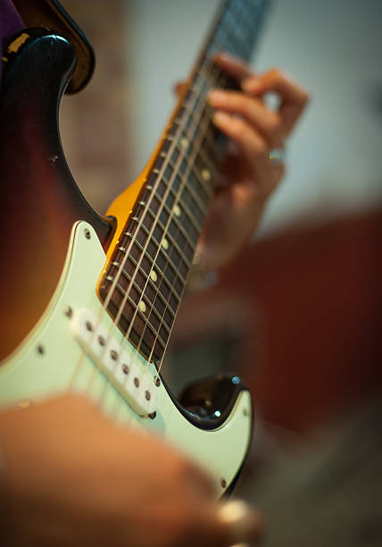 istock Guitar chords detail with human hands playing 544582552