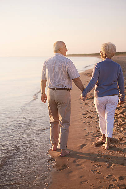 istock Senior couple walking hand by hand 544582858