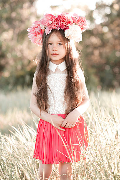 istock Smiling kid girl standing in field 544583848