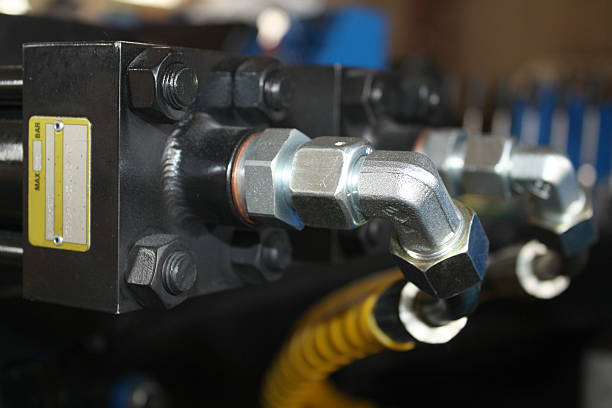 istock Hydraulic cylinder with hose protection and pipe connections 544584160