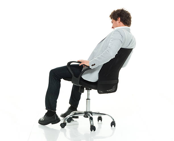 istock Smiling smart casual man sitting on chair 544585362