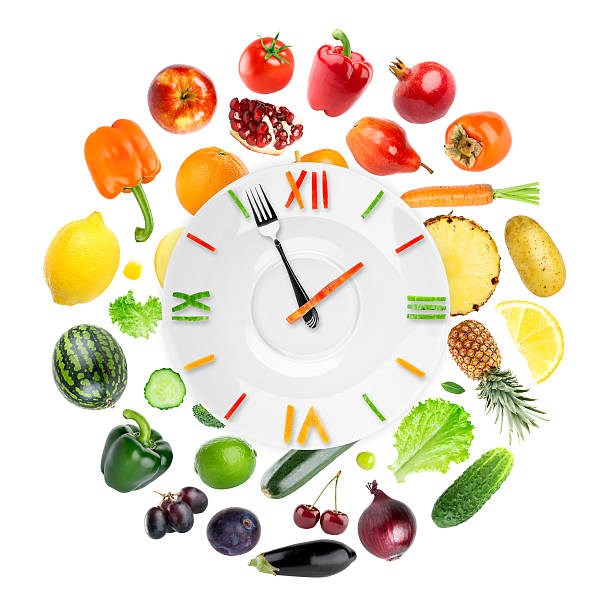 istock Food clock with fruits and vegetables 544586926