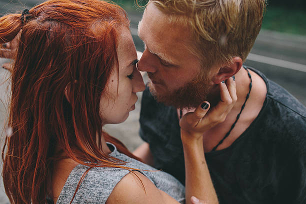 istock beautiful couple hugging in the rain 544587538