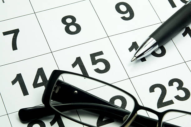 istock A calendar, glasses and a ballpoint pen 544590416