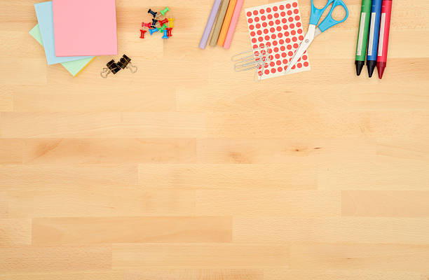 istock Office Supplies on a wooden desk. Copy Space. 544590520