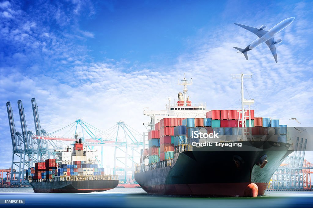 Container Cargo ship and Cargo plane with working crane Container Cargo ship and Cargo plane with working crane bridge in shipyard background, logistic import export background and transport industry. Freight Transportation Stock Photo