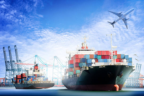 Container Cargo ship and Cargo plane with working crane Container Cargo ship and Cargo plane with working crane bridge in shipyard background, logistic import export background and transport industry. trader stock pictures, royalty-free photos & images