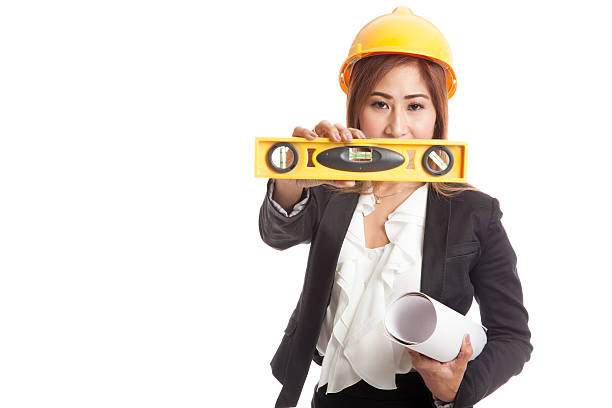 istock Asian engineer woman with blueprints and level 544592458