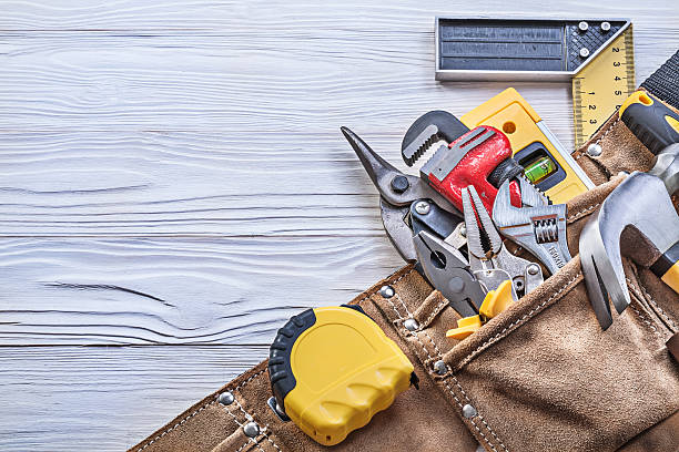 istock Building tooling in tool belt on wooden board construction conce 544593560