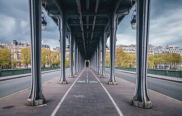Bir-Hakeim Bridge in Paris France Walkway and bike lane underneath the Bir Hakeim Bridge in Paris, France seine river photos stock pictures, royalty-free photos & images