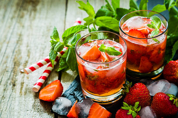 istock Strawberry mojito and ingredients on rustic background 544594720