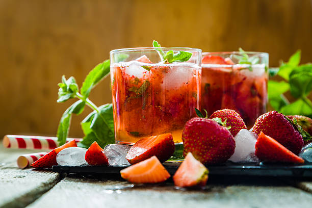 istock Strawberry mojito and ingredients on rustic background 544594978