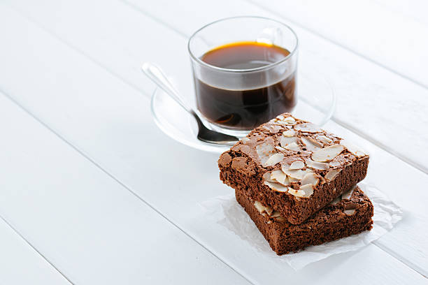 Almond brownies cake and hot coffee stock photo
