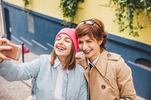 istock Daughter and Mother taking selfie in Paris streets 544595644