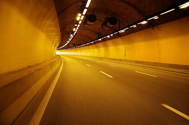 istock Empty highway road at night tunnel with speed motion blur 544595994