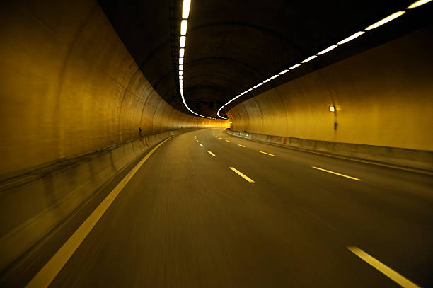 istock Empty highway road at night tunnel with speed motion blur 544596042