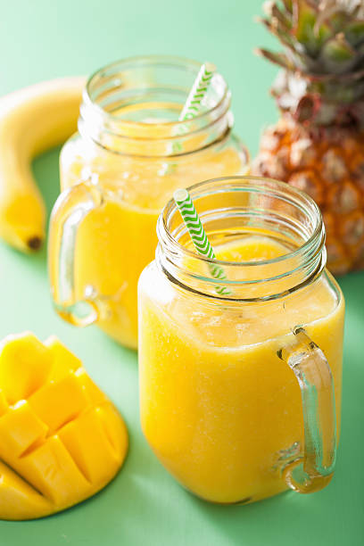 istock healthy yellow smoothie with mango pineapple banana in mason jar 544600434