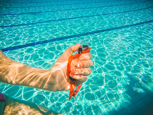 istock swimming goggles in hand on pool 544601426