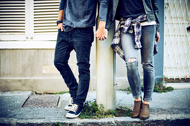 istock Low section of couple holding hands at pole 544603348