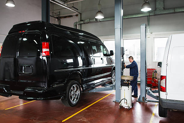 istock Mechanic rising car on lift before maintenance 544604350