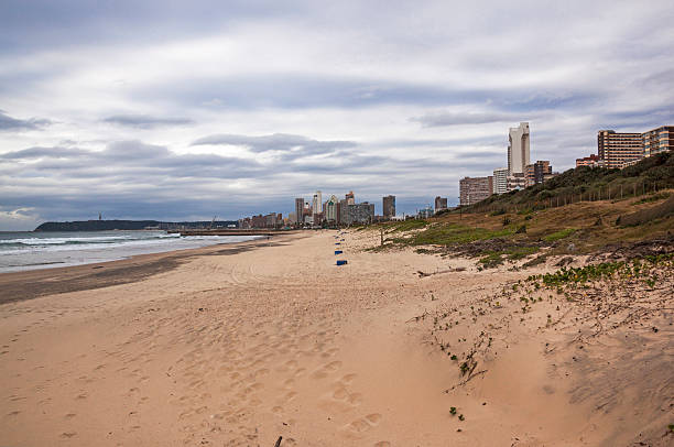 istock Empty Beach Sand Dunes and Vegetation Against  City Skyline 544604764