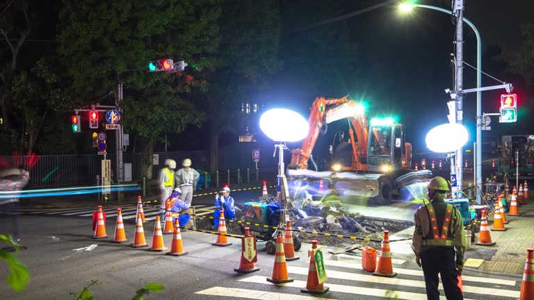 night scene of road repair constructions site in tokyo at night.