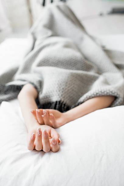istock girl hiding from the problems under the blanket 544651208