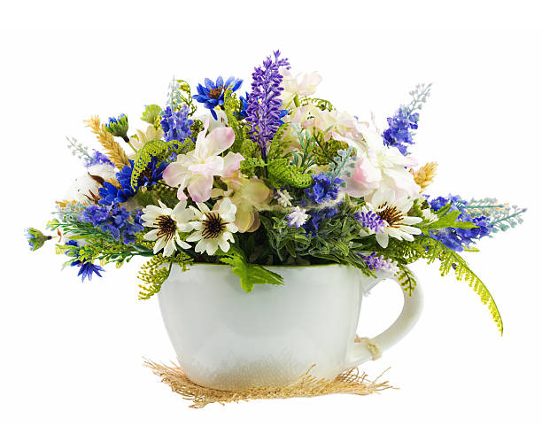 istock Table floral arrangement made of artificial flowers. 544651916