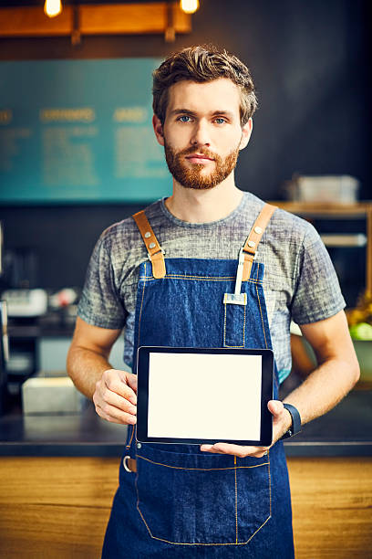 istock Barista holding digital tablet in cafe 544652236
