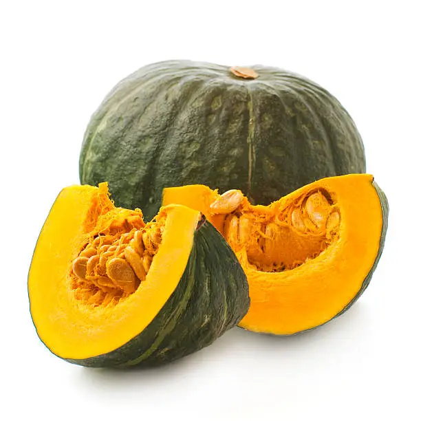 whole and sliced of Japanese pumpkin kabocha on a white background