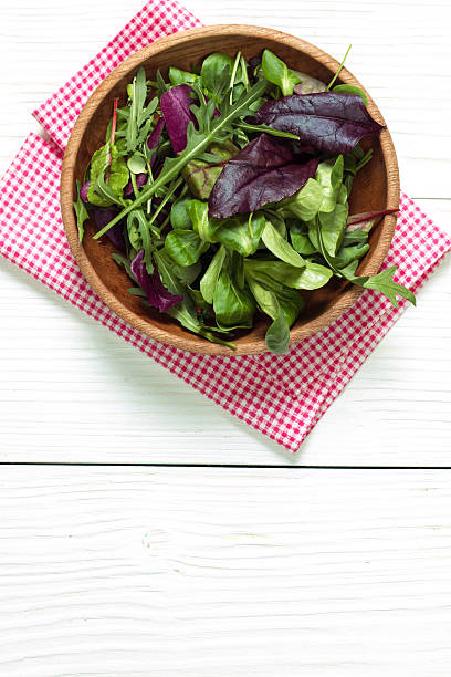 istock Fresh green salad with spinach ,ruccola,lettuce on wooden table. 544653866