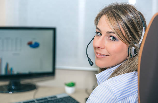 istock Smiling blonde secretary working with computer in office 544654038