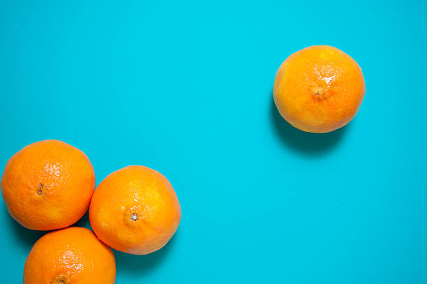 istock Fresh orange fruits and juice on marble table. 544654814