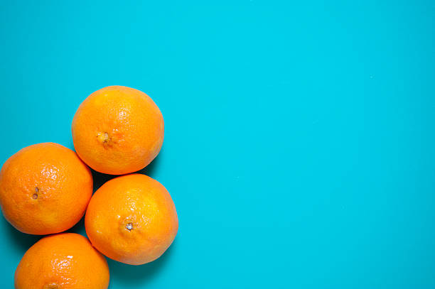 istock Fresh orange fruits and juice on marble table. 544654896