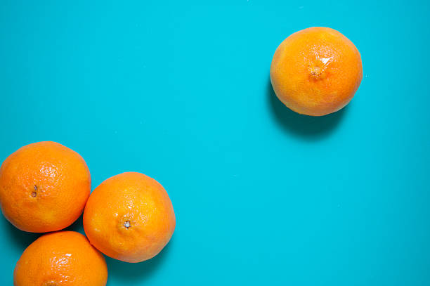 istock Fresh orange fruits and juice on marble table. 544654948