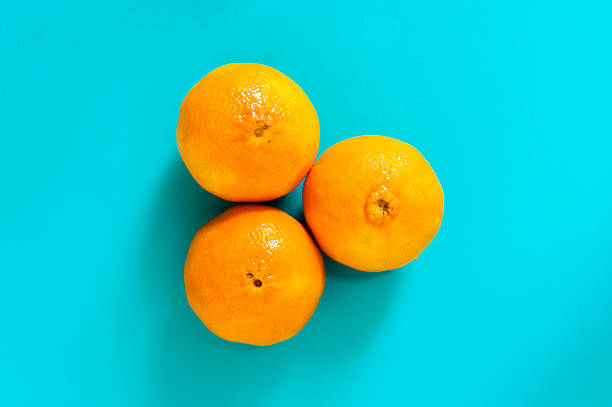 istock Fresh orange fruits and juice on marble table. 544655478