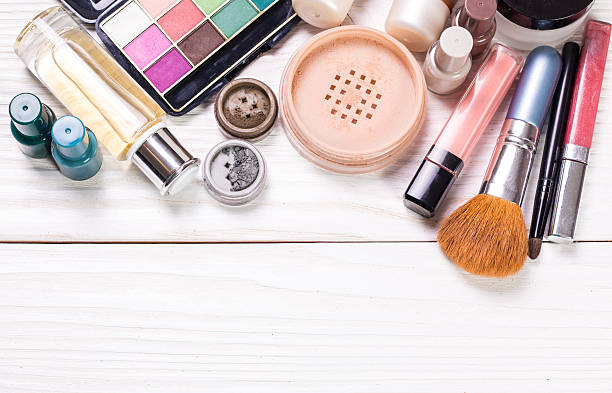 istock Various makeup products on wooden background with copyspace 544656416