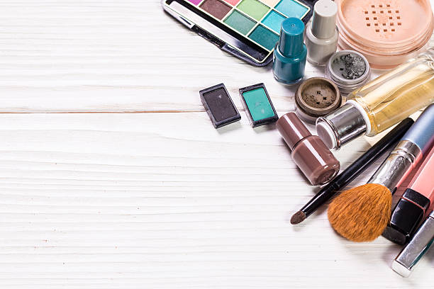 istock Various makeup products on wooden background with copyspace 544656476