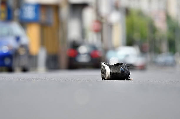 istock Shoe on the street after accident 544658254