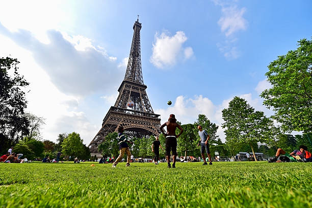 Paris, France - June 8, 2016: Giant soccer ball suspended on the Eiffel Tower during the UEFA 2016 European Championship.