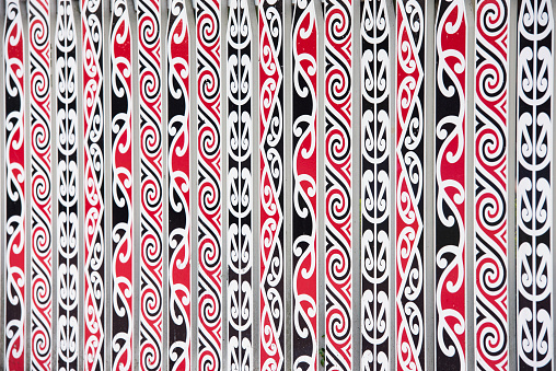 painted Maori decorations on the fence in Rotorua, New Zealand