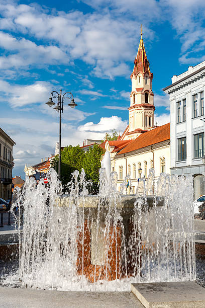 istock Fountain and church, Old town Vilnius, Lithuania. 544658626