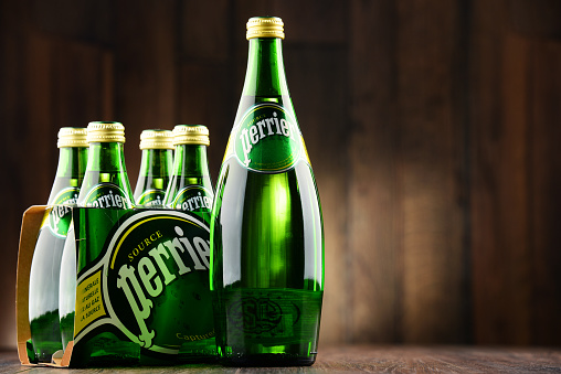 Poznan, Poland - June 22, 2016: Perrier is a French brand of natural bottled mineral water sold worldwide and available in 140 countries.