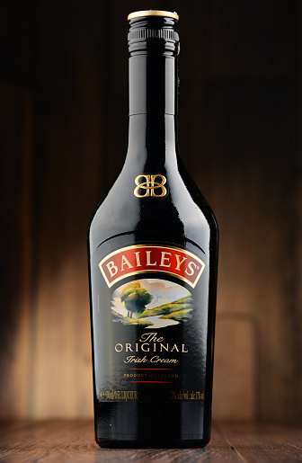 Poznan, Poland - June 22, 2016: Baileys Irish Cream is an Irish whiskey- and cream-based liqueur, made by Gilbeys of Ireland. Brand currently owned by Diageo.