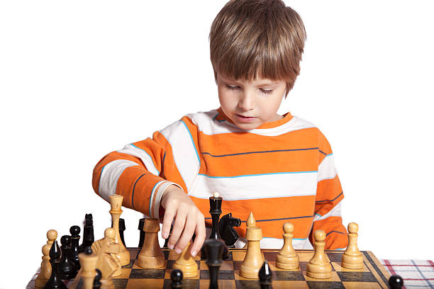 istock Portrait of a little boy playing chess 544659484
