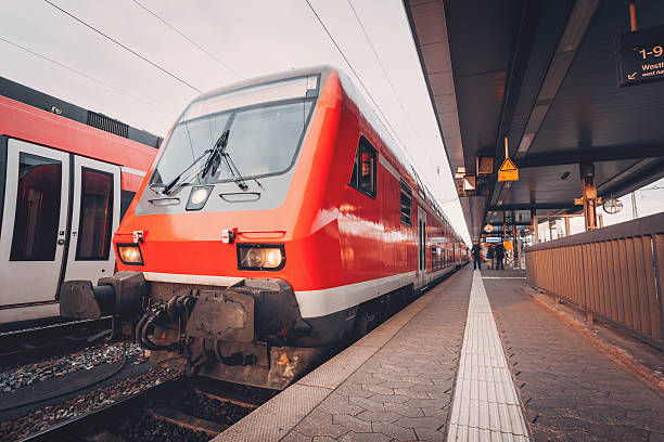 istock Beautiful red commuter train at railroad platform in the evening 544659750
