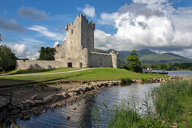 Killarney, Ireland - June 15, 2016: Ross Castle is a 15th-century tower house and keep on the edge of Lough Leane, in Killarney National Park, County Kerry in the Republic of Ireland It is the ancestral home of the O'Donoghue clan.