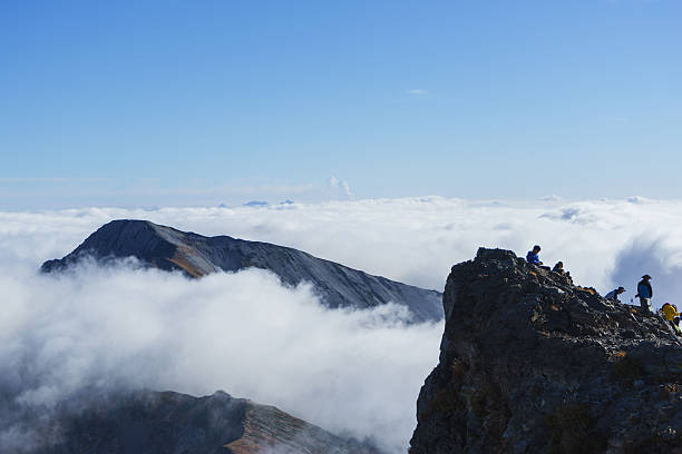The day of Mount Ontake-san eruption Kitaazumi county, Hakuba Village, Nagano, Japan - September 27, 2014: Valcanic smoke rising high sky from Mount Ontake-san beyond the sea of clouds. mt ontake stock pictures, royalty-free photos & images