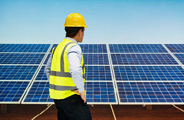istock Rear view of solar worker looking away 544664292