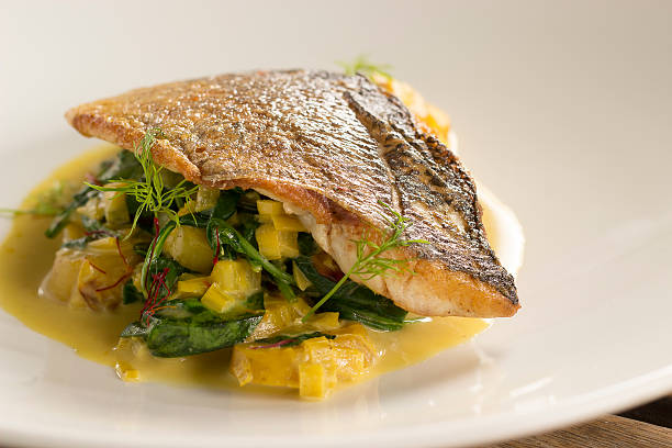 istock Seabass with saffron, garlic & potato broth 544665838